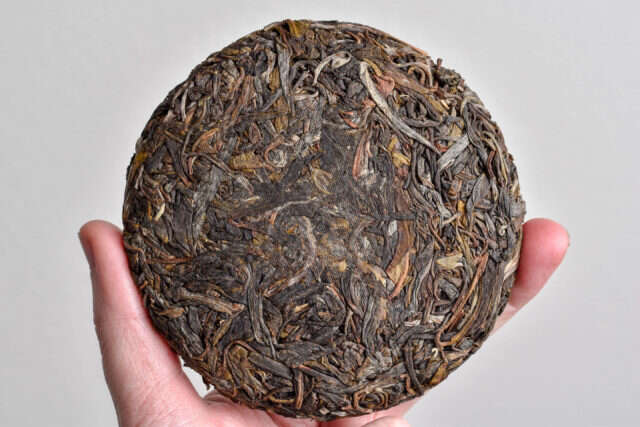 a small 100g pressing of sheng pu'er tea a small 100g pressing of sheng pu'er tea