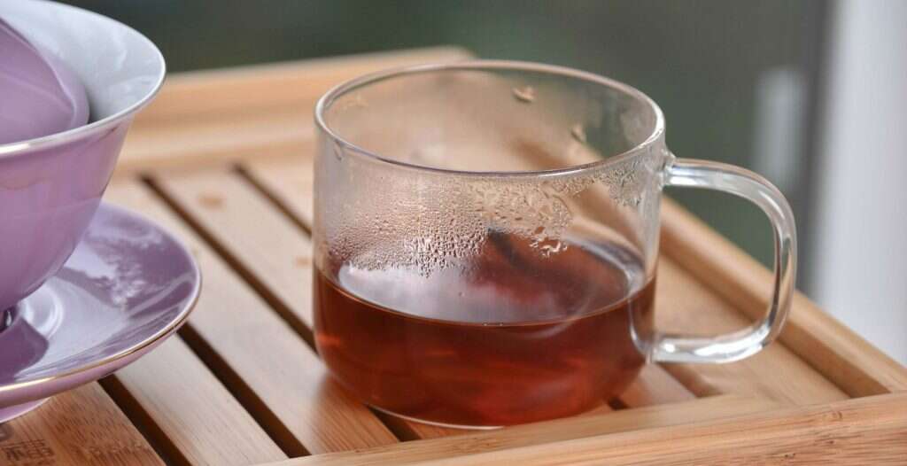 a cup of Xingyang shu pu'er is bright and transluscent, not cloudy or murky